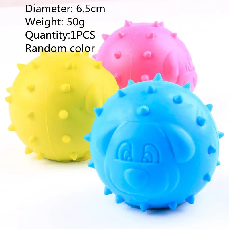 Three rubber chew toys in yellow, pink, and blue with spiky textures.
