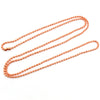 A set of delicate rose gold plated ball bead necklaces laid out on a white background.