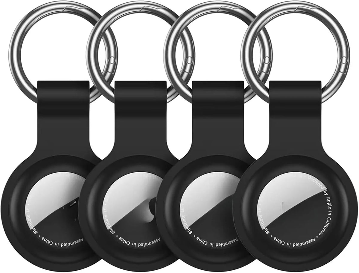 A black silicone protective cover for an AirTag attached to a metal keychain ring.