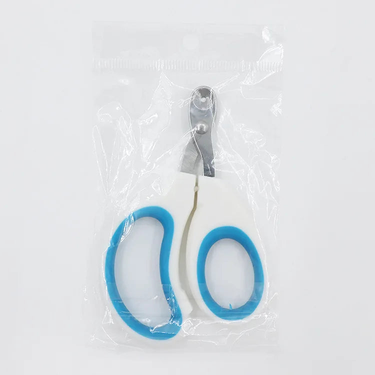 Klare Plastikverpackung mit Edelstahl-Krallenutzern und blauer Silikon-Nagelhalter.