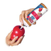 A hand is holding a tube of KONG peanut butter dog chew toy with treat dispensing core.