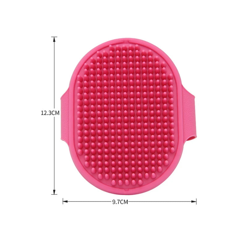 A pink soft rubber pet grooming brush with a textured surface for dogs and cats.