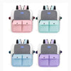 A set of four ventilated cat carrier backpacks in pink, mint green, light blue, and purple.