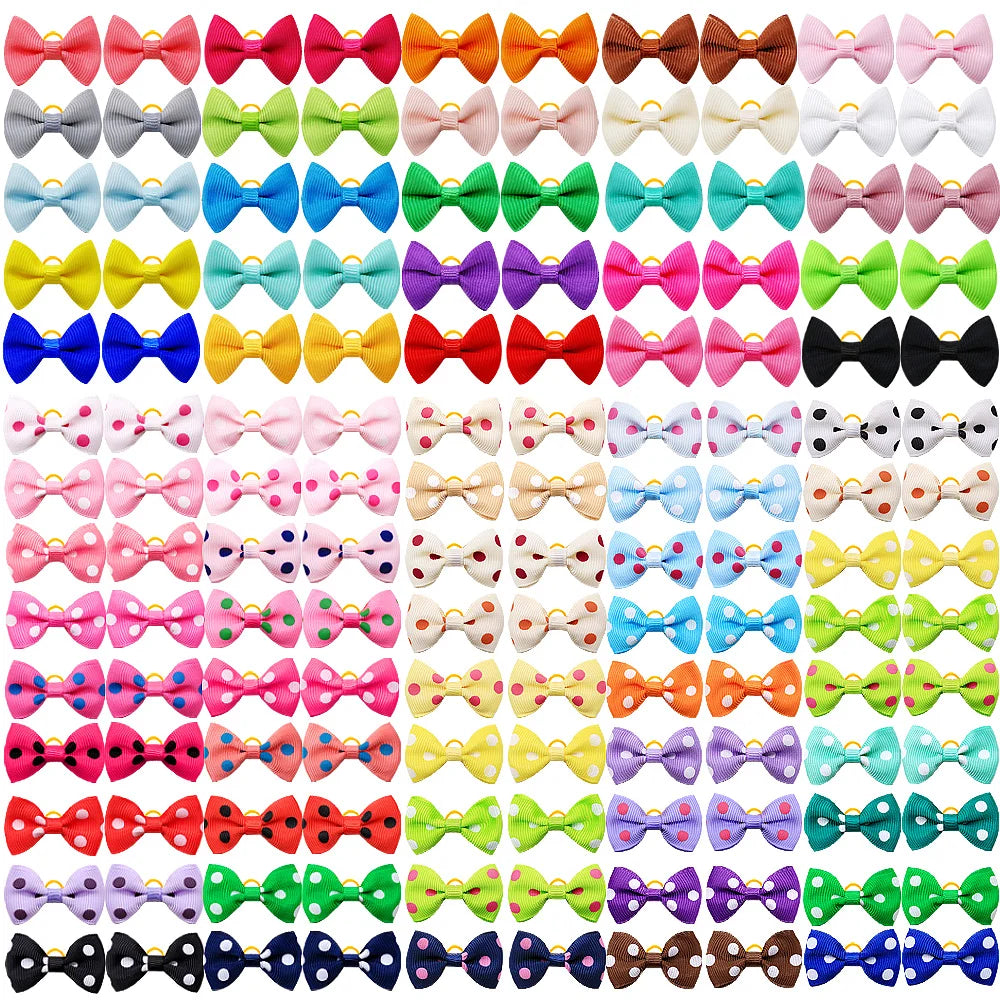 A pack of 100 polka dot pet bows in various colors and patterns with rubber bands for dog hair accessories