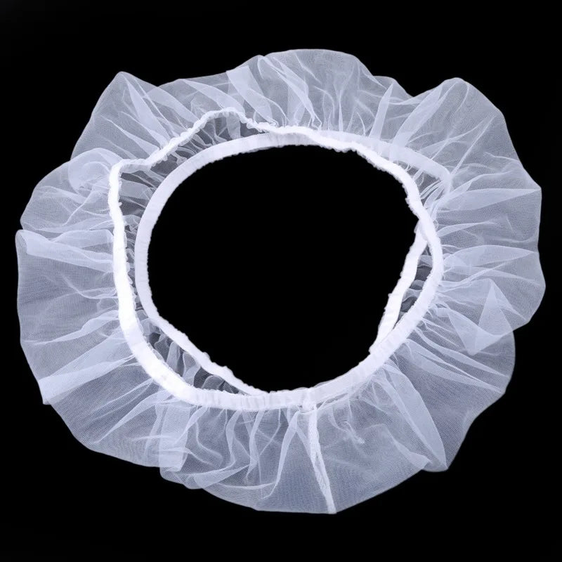 White nylon mesh skirt designed as a debris guard for a bird cage seed catcher.