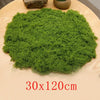 A large, vibrant green preserved moss sheet measuring 30x120cm placed on a wooden surface.