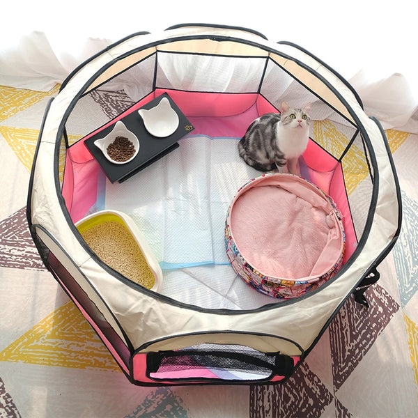 A folding octagonal pet cage for dogs with a cat inside, featuring pink and white fabric.
