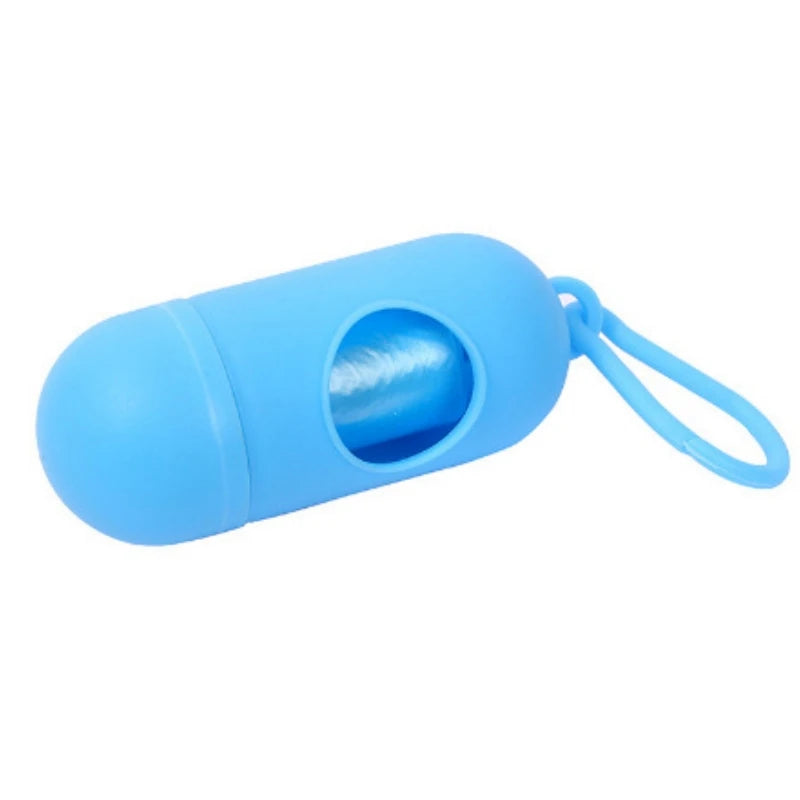 A blue capsule-shaped dog poop bag dispenser with a carabiner clip.
