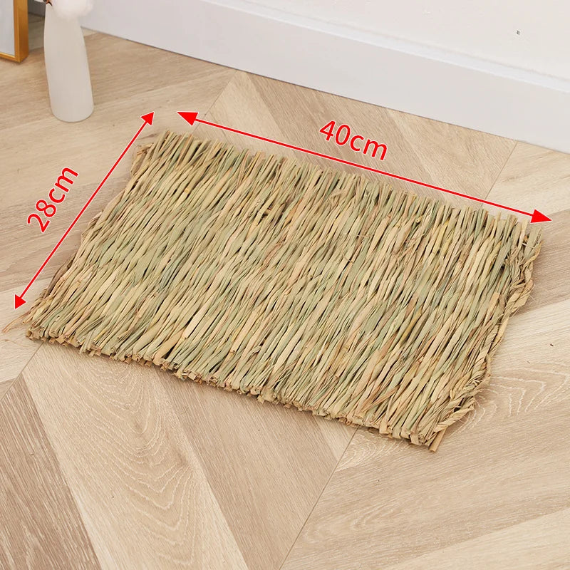 A rectangular mat woven from natural straw placed on a light wooden floor.