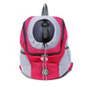 A pink and gray portable pet carrier backpack with a black top section.