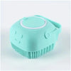 A light blue silicone dog bath brush with a dispenser top is shown from above.
