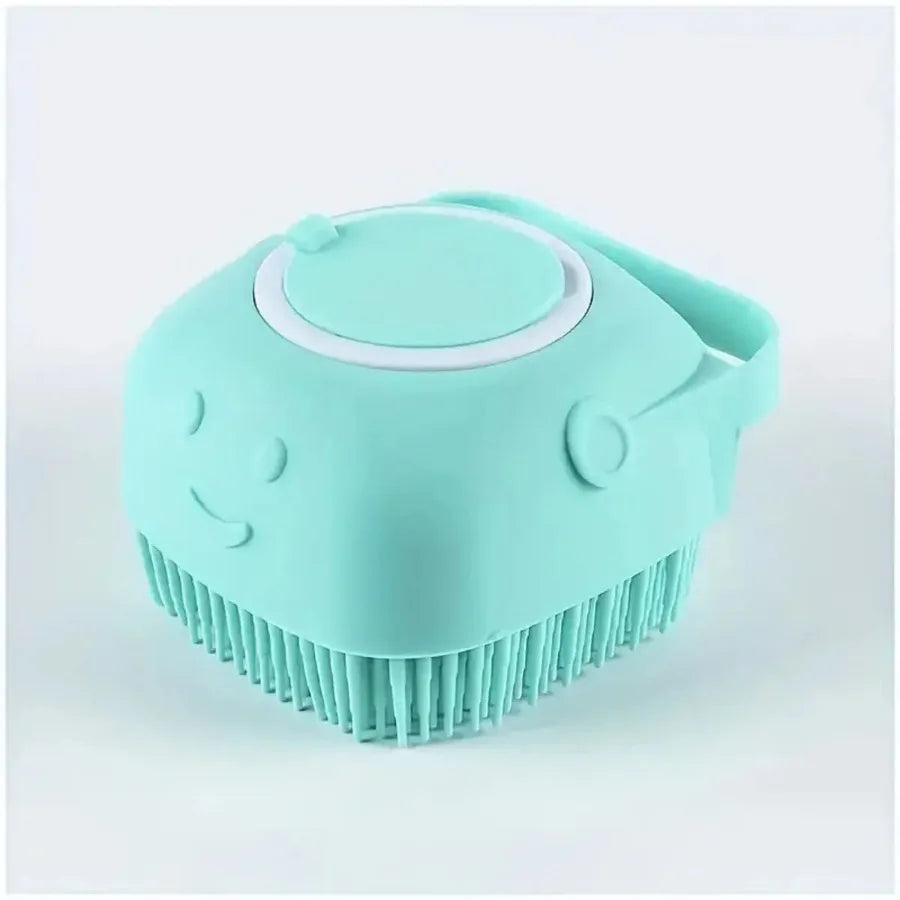 A light blue silicone dog bath brush with a dispenser top is shown from above.