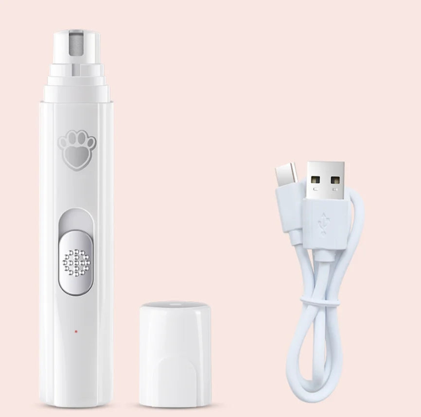 A white dual speed pet nail trimmer with a pump dispenser and a separate charging cable is shown on a light pink background.