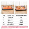 A gray orthopedic dog bed with an orange cushion shown in various sizes and with a dog resting on it.