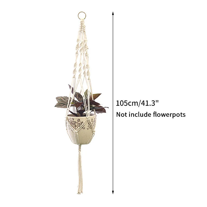 A macrame plant hanger with a hanging loop and a decorative pot, shown against a white background.