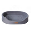 A gray washable waterproof dog bed mat with a padded, oval shape.