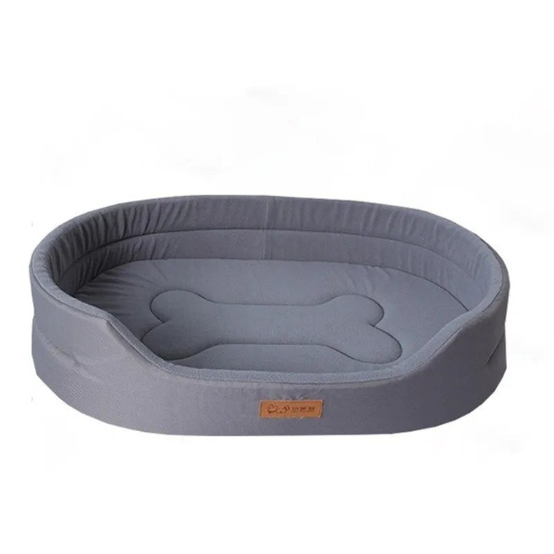 A gray washable waterproof dog bed mat with a padded, oval shape.
