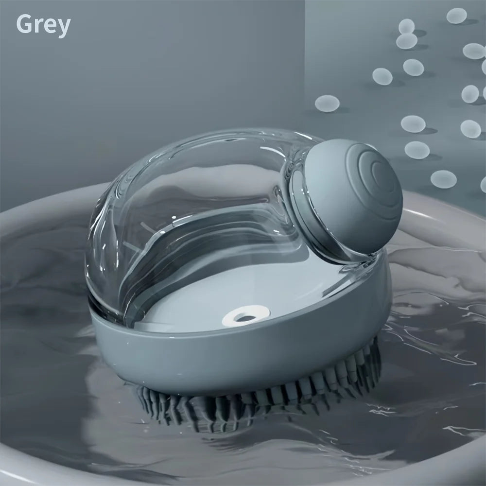 A grey pet bath brush with a clear dispenser is shown submerged in water.