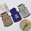 Three pet vests in brown, blue, and gray featuring a cartoon bear design.