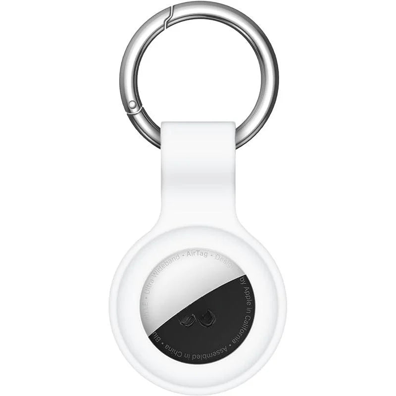 A white silicone protective cover for an AirTag with a metal keychain ring.