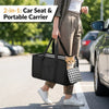 A person is carrying a black 2-in-1 car seat and portable carrier for a cat in a tote bag on a street.