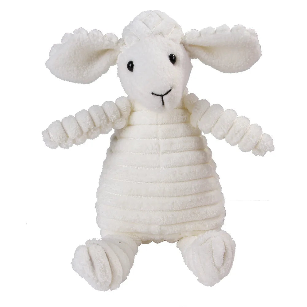 Un juguete de peluche blanco que parece una oveja o corderito con orejas caídas y una expresión dulce.