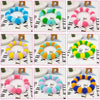 A set of colorful rainbow flower pet collars and bow ties arranged in various shades and patterns.
