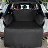 Black durable waterproof dog car seat cover installed in the rear cargo area of a vehicle.