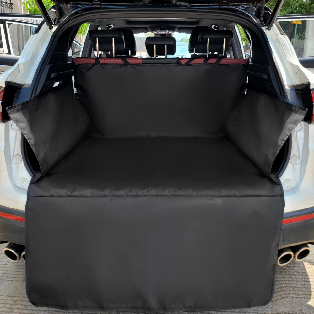 Black durable waterproof dog car seat cover installed in the rear cargo area of a vehicle.