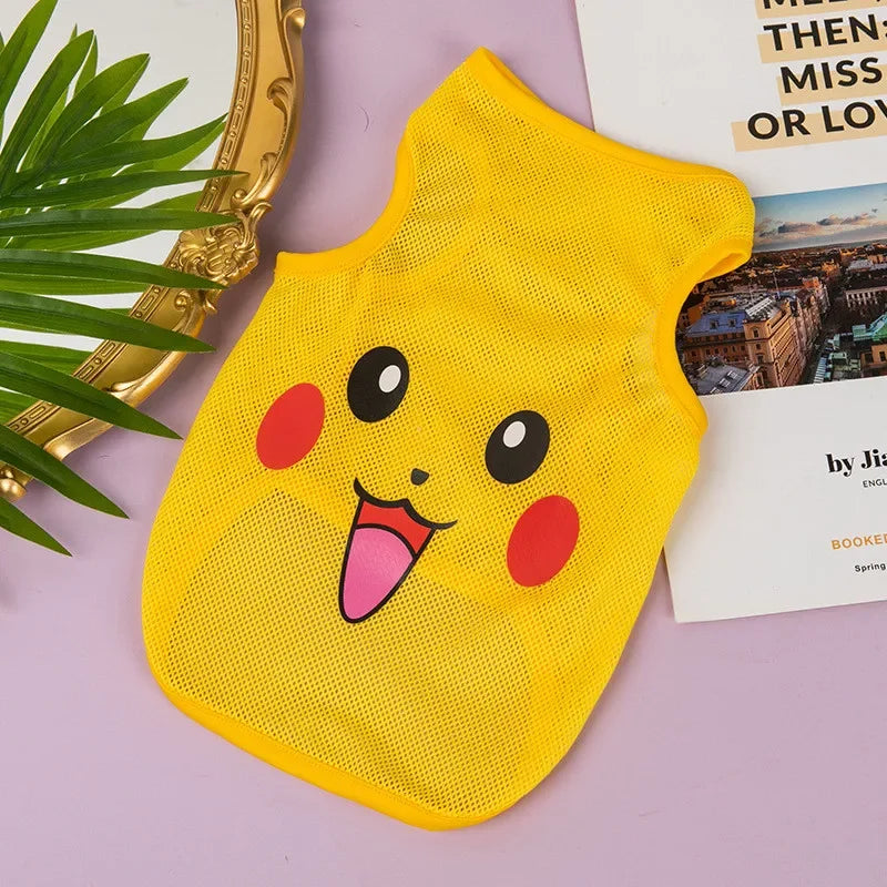A yellow breathable mesh pet vest with a cute cartoon face print lying on a purple surface.