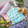 A collection of soft, colorful fleece hammocks for small pets, including pink, blue, and purple varieties.