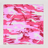 A close-up of a pink and white camouflage print cotton bandana.