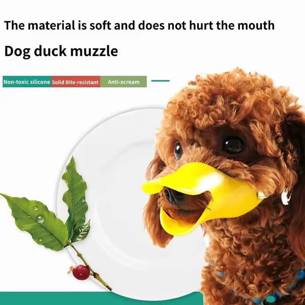 A brown dog wearing a yellow silicone muzzle on a white plate with a green leaf.