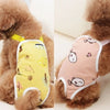 A brown dog wearing a pink adjustable washable sanitary pant with shoulder straps.