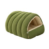 A green, ribbed plush cat cave bed with a removable beige lining.