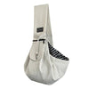 A white ribbed crossbody pet carrier bag with a black trim and flap.