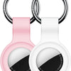 A pink silicone protective cover for an AirTag attached to a metal keychain ring.