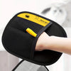 A hand is holding a black electrostatic hair removal glove with a yellow accent, demonstrating the product for pet grooming.