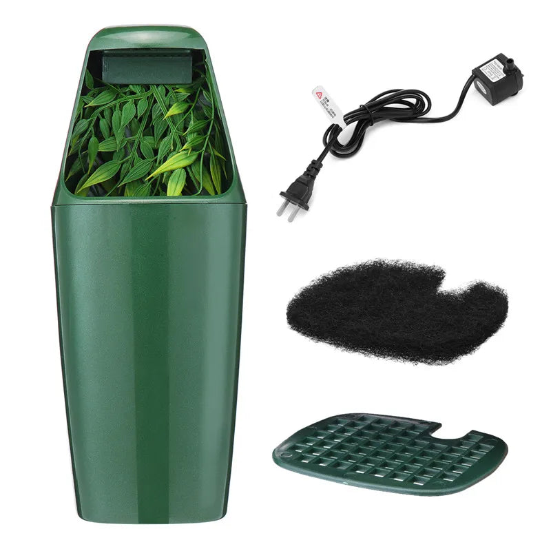 A green reptile drinking water filter fountain with a coiled black electrical cord and a green plastic tray.