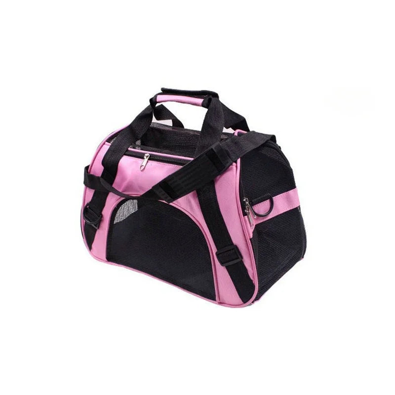 A pink and black portable foldable pet carrier for cats and dogs with a handle.
