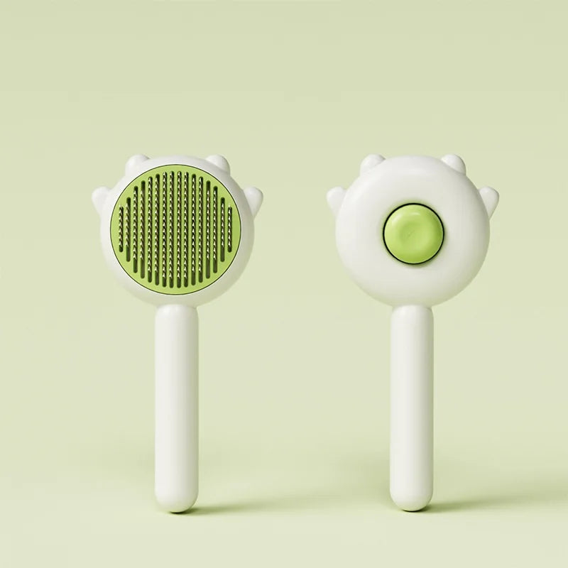A white pet hair removal slicker brush with a green textured head and a smooth body.