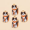 A set of four colorful cat and animal pendant charms for jewelry making featuring black, white, and orange patterns.
