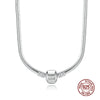 A silver snake chain necklace with a heart charm displayed against a white background.