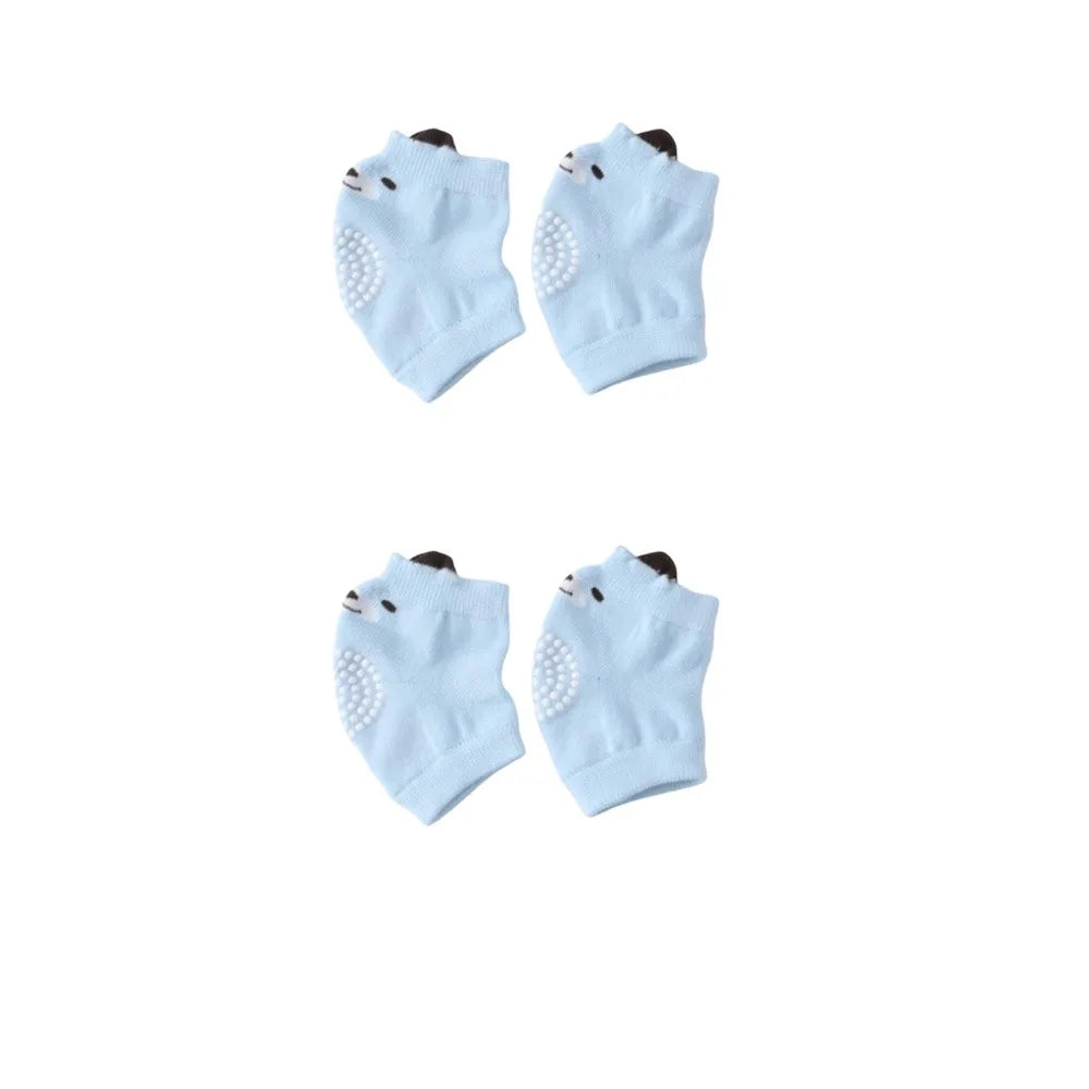 A pair of light blue breathable dog knee pads with white dots for joint protection and floor traction.