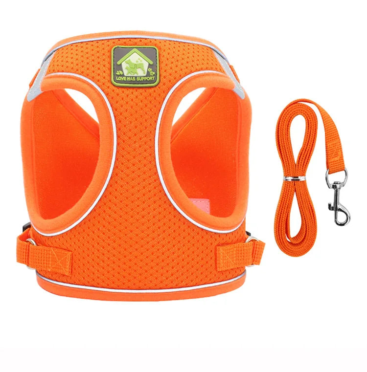 Orange mesh dog harness with reflective strips and an adjustable strap for small pets