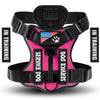 A pink and black harness for a service dog with an adjustable fit.