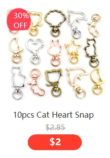 A set of ten antique silver cat heart snap charms for jewelry making.