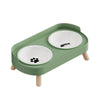 A light green stainless steel double bowl for dogs and cats with two white bowls.