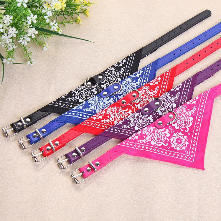 A collection of colorful adjustable triangle pet bandana collars for dogs and cats displayed on a light background.