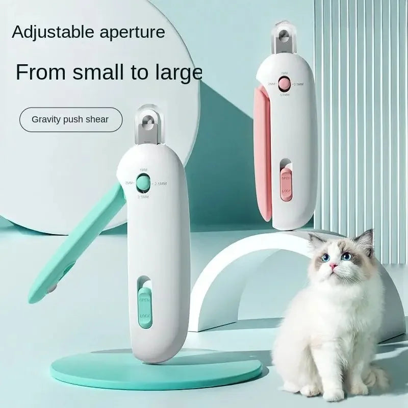 A white pet nail clipper trimmer is shown next to a small cat, demonstrating its adjustable aperture feature.